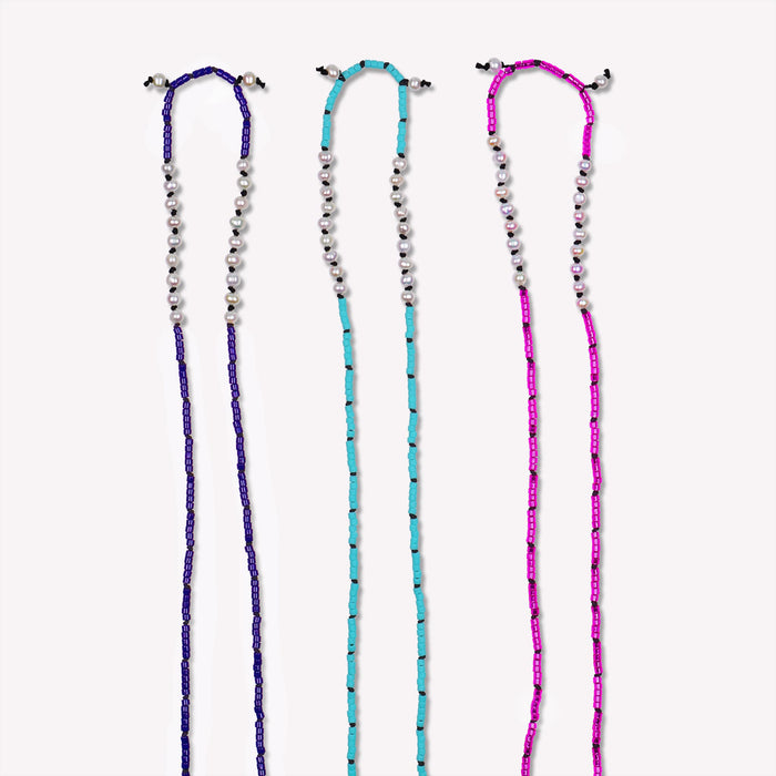 Freshwater Pearl Sawyer Pullover Necklace. Hand-knotted on black silk cord. Available colors shown are Midnight Blue, Sky Blue and Pop of Pink. $145 each. 23 inches in length. Detailed image of top half.