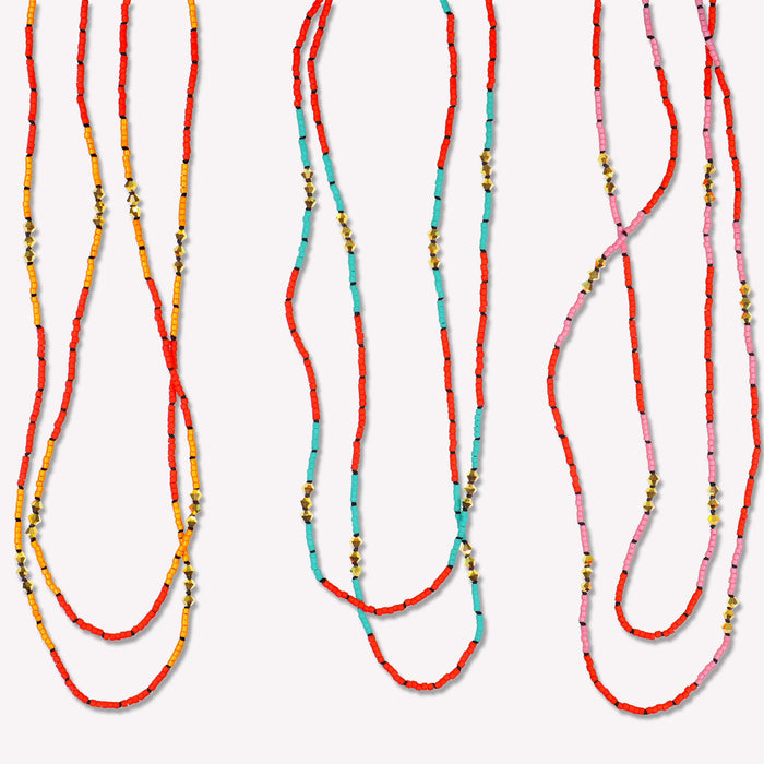 Gold Malibu Short Necklace hand-knotted on a black silk cord. Available in Vivid Mango, Vivid Sky Blue and Vivid Petal Pink. Pair two necklaces for a layered look. 16 and 17 inch lengths displayed here.