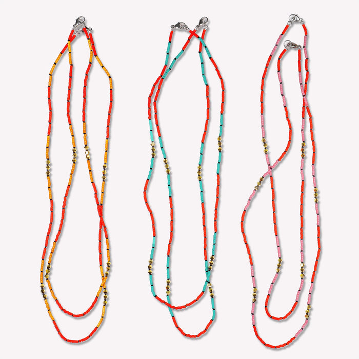 Gold Malibu Short Necklace hand-knotted on a black silk cord. Available in Vivid Mango, Vivid Sky Blue and Vivid Petal Pink. Pair two necklaces for a layered look. 16 and 17 inch lengths displayed here.