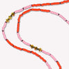 Gold Malibu Short Necklace hand-knotted on a black silk cord. Detailed view of necklace in Vivid Petal Pink. Made to order in 14 to 17 inch lengths.