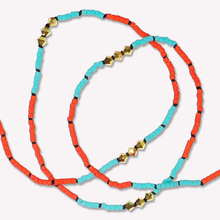 Gold Malibu Short Necklace hand-knotted on a black silk cord. Detailed view of necklace in Vivid Sky Blue. Made to order in 14 to 17 inch lengths.