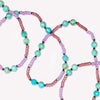 Zoomed in view of Turquoise Laredo midi necklace in thistle.